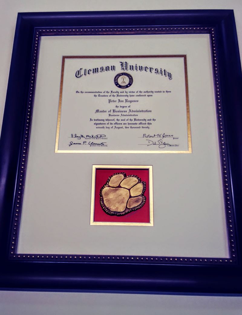Clemson diploma with cast paw
